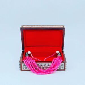 Ornate Wooden Jewelry Box with Mother-of-Pearl Inlay and Pink Coral Bead Necklace